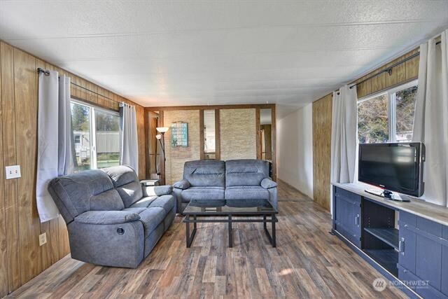 33816 Aztec Lane Cheney, WA 99004 - Photo 4 of 24 a living room with furniture and a flat screen tv