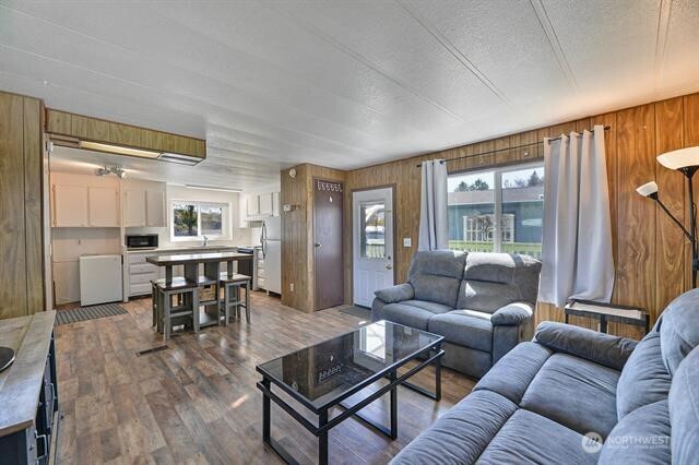 33816 Aztec Lane Cheney, WA 99004 - Photo 5 of 24 a living room with furniture wooden floor and a large window