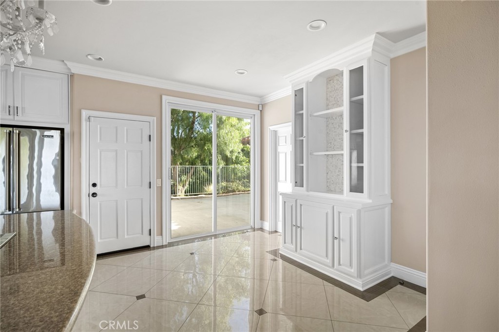 7370 West Chantilly Court Tujunga, CA 91042 - Photo 15 of 55 a view of an empty room with wooden floor and a window