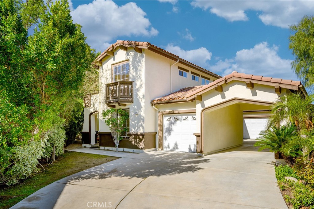 7370 West Chantilly Court Tujunga, CA 91042 - Photo 2 of 55 a front view of a house with a yard