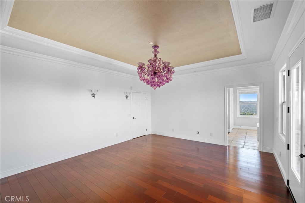 7370 West Chantilly Court Tujunga, CA 91042 - Photo 23 of 55 wooden floor in an empty room with a window