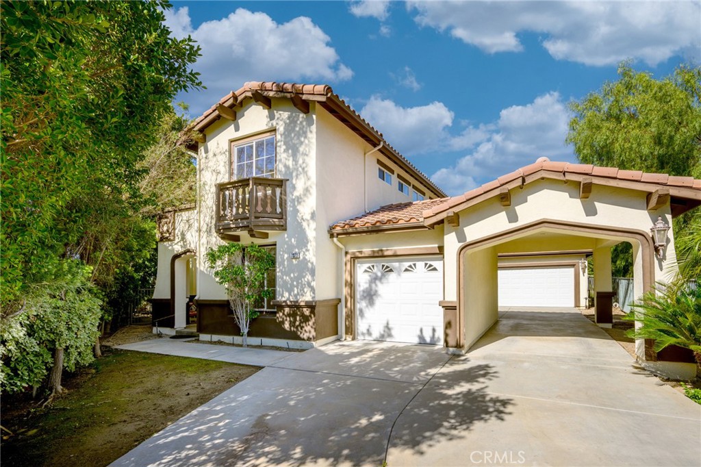 7370 West Chantilly Court Tujunga, CA 91042 - Photo 3 of 55 a front view of a house with a yard