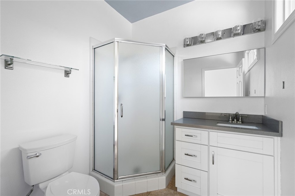 7370 West Chantilly Court Tujunga, CA 91042 - Photo 34 of 55 a bathroom with a granite countertop sink toilet and shower