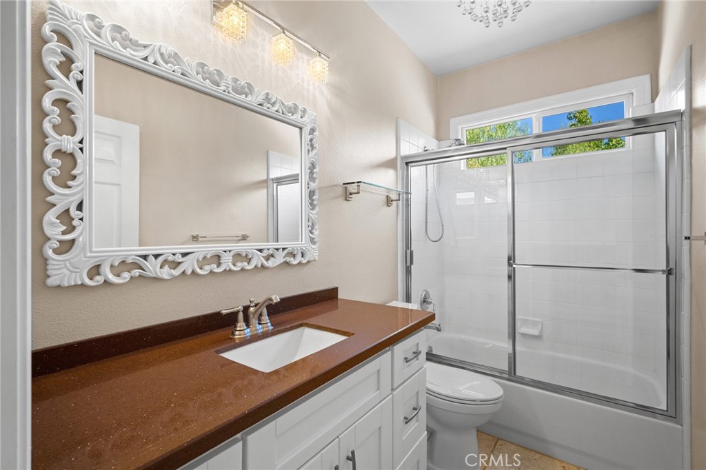 7370 West Chantilly Court Tujunga, CA 91042 - Photo 37 of 55 a bathroom with a sink vanity mirror and toilet
