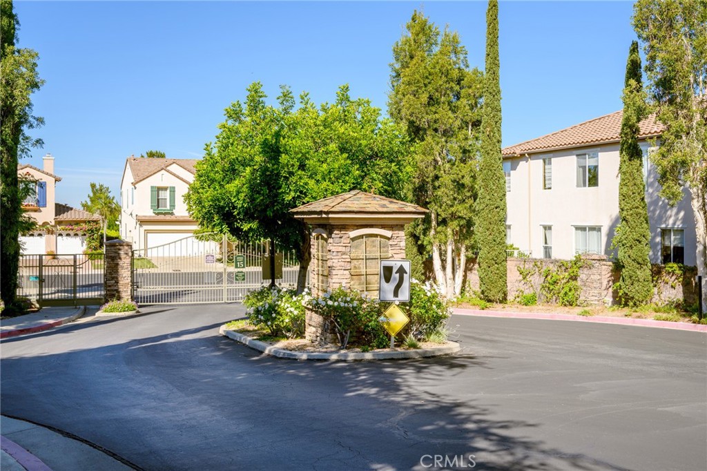 7370 West Chantilly Court Tujunga, CA 91042 - Photo 53 of 55 a front view of a house with a yard and garage