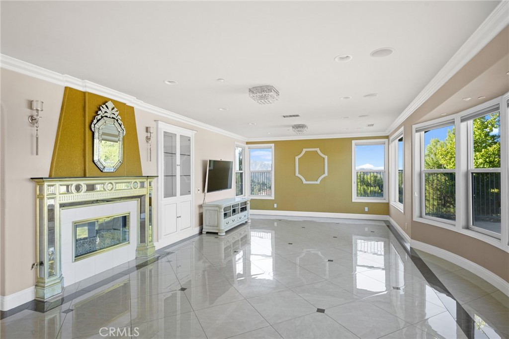 7370 West Chantilly Court Tujunga, CA 91042 - Photo 10 of 55 a living room with furniture a fireplace and a large window