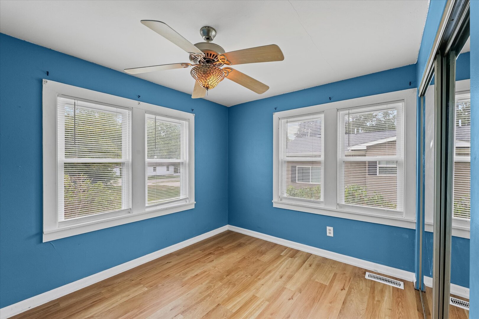 3 Morfey Court Monticello, IL 61856 - Photo 17 of 32 a view of an empty room with wooden floor and a window