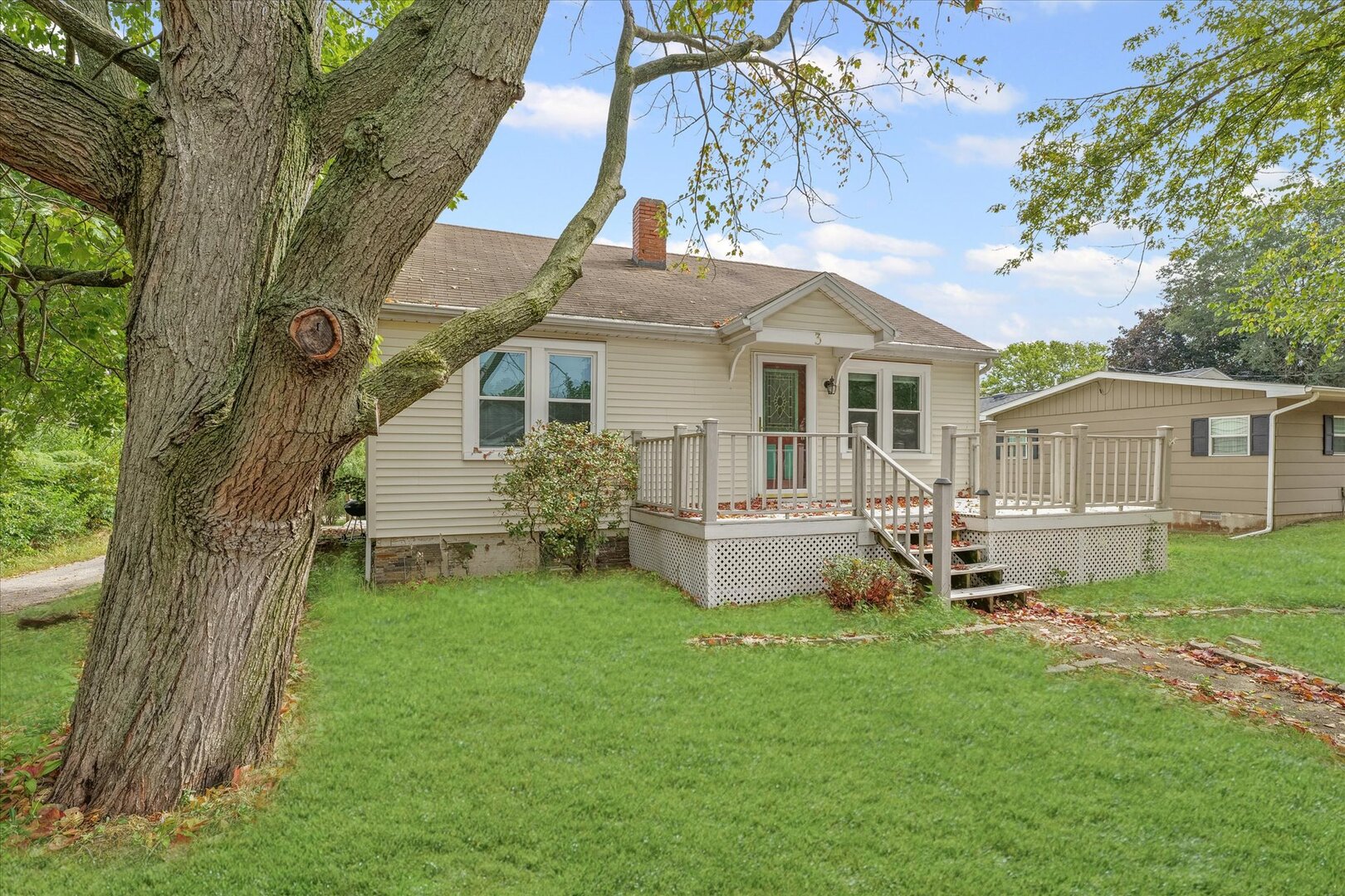 3 Morfey Court Monticello, IL 61856 - Photo 2 of 32 a front view of a house with a garden and chairs