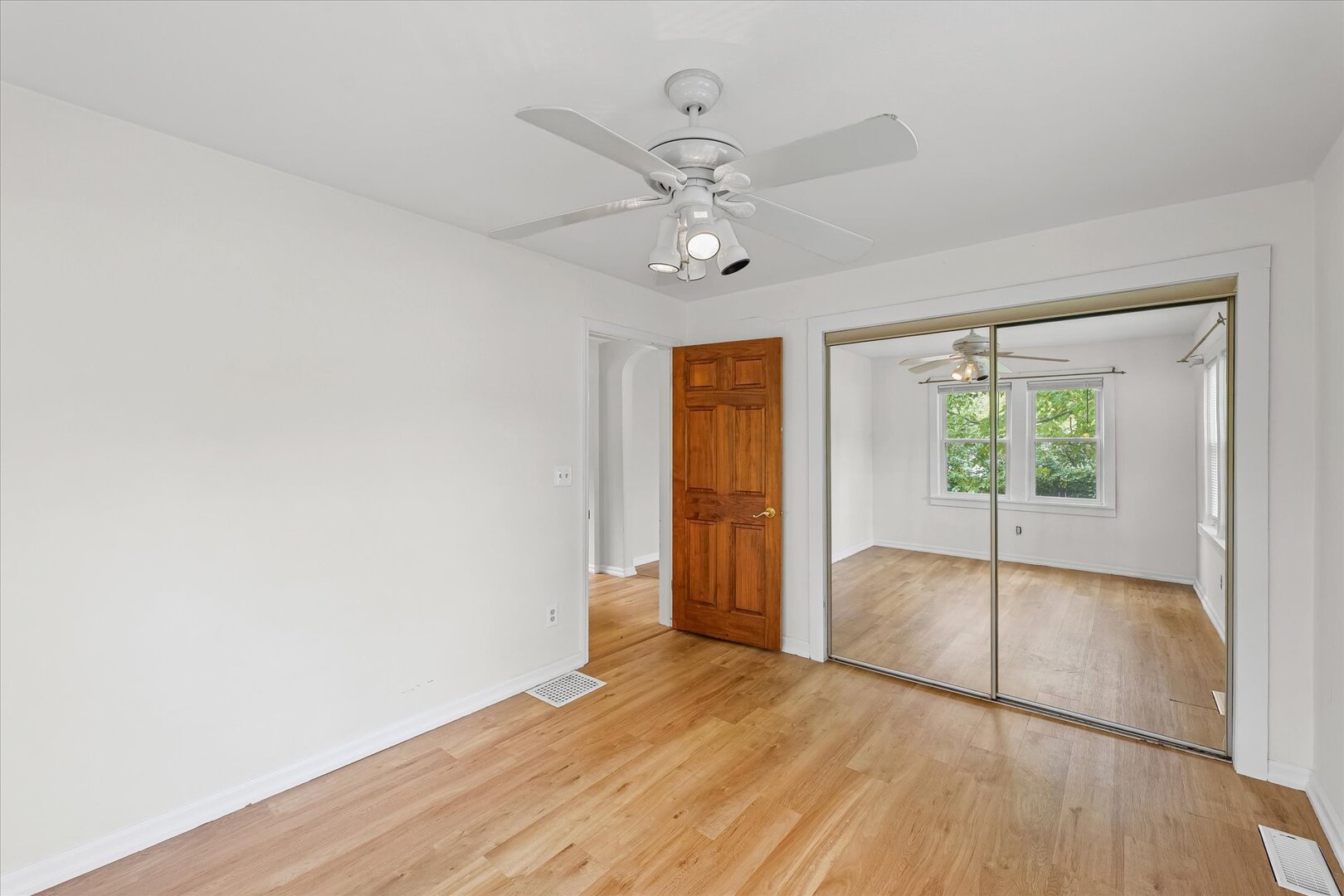 3 Morfey Court Monticello, IL 61856 - Photo 21 of 32 wooden floor in an empty room with a window