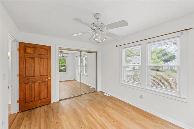 a view of an empty room with wooden walls