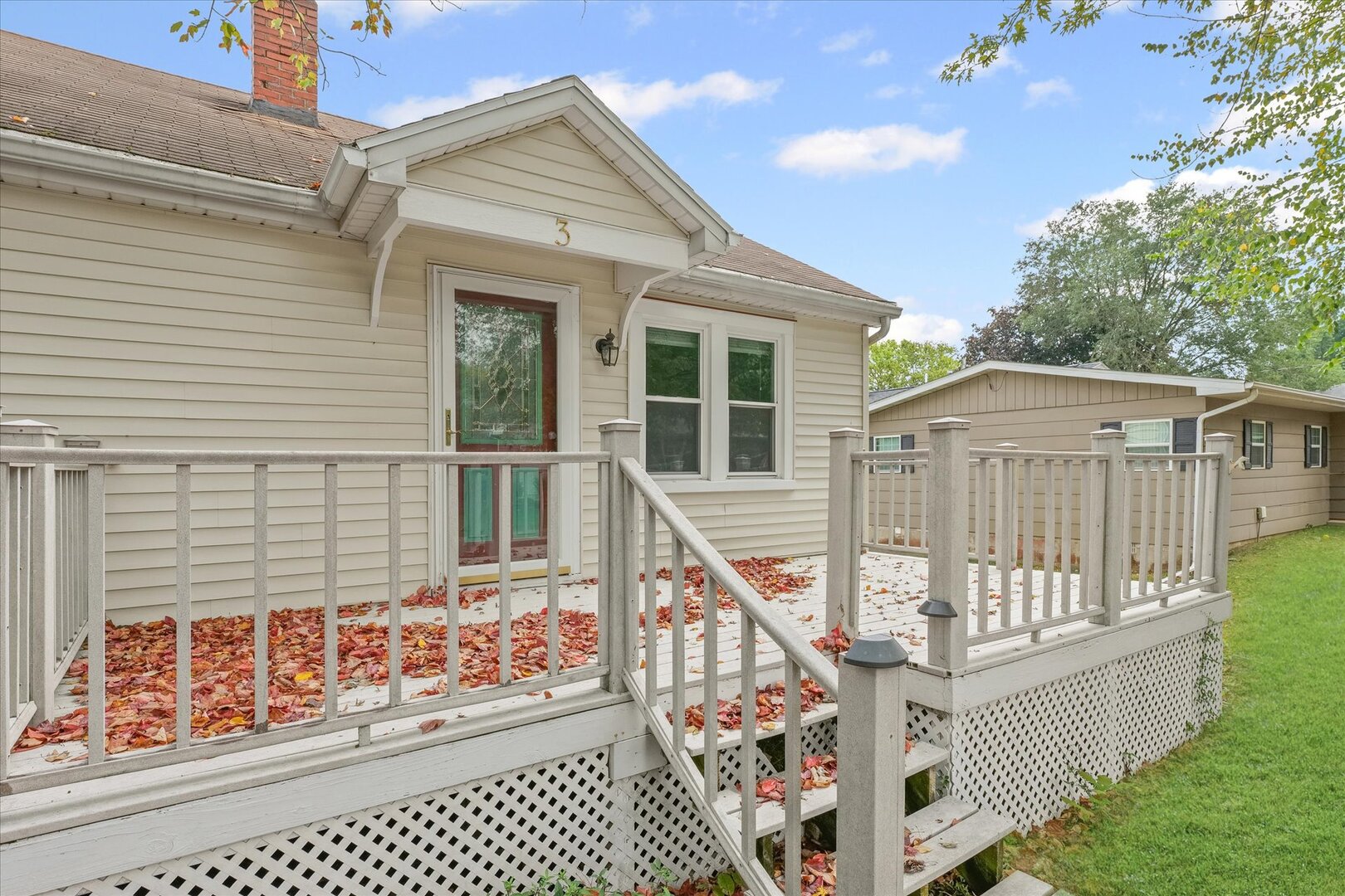 3 Morfey Court Monticello, IL 61856 - Photo 4 of 32 a house with wooden fence and a bench