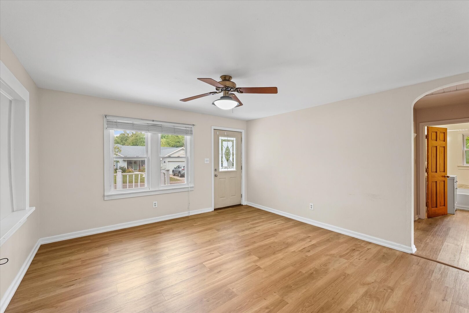 3 Morfey Court Monticello, IL 61856 - Photo 8 of 32 an empty room with wooden floor and windows