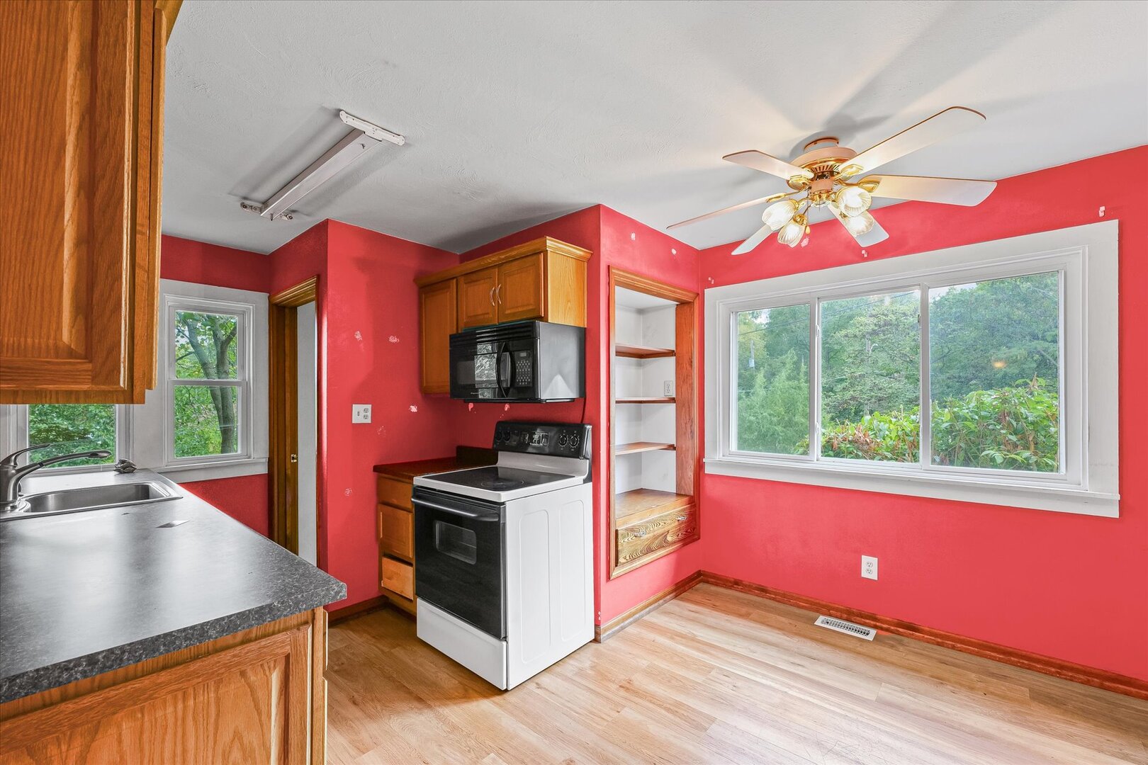 3 Morfey Court Monticello, IL 61856 - Photo 10 of 32 a kitchen with stainless steel appliances granite countertop a stove a sink and a window