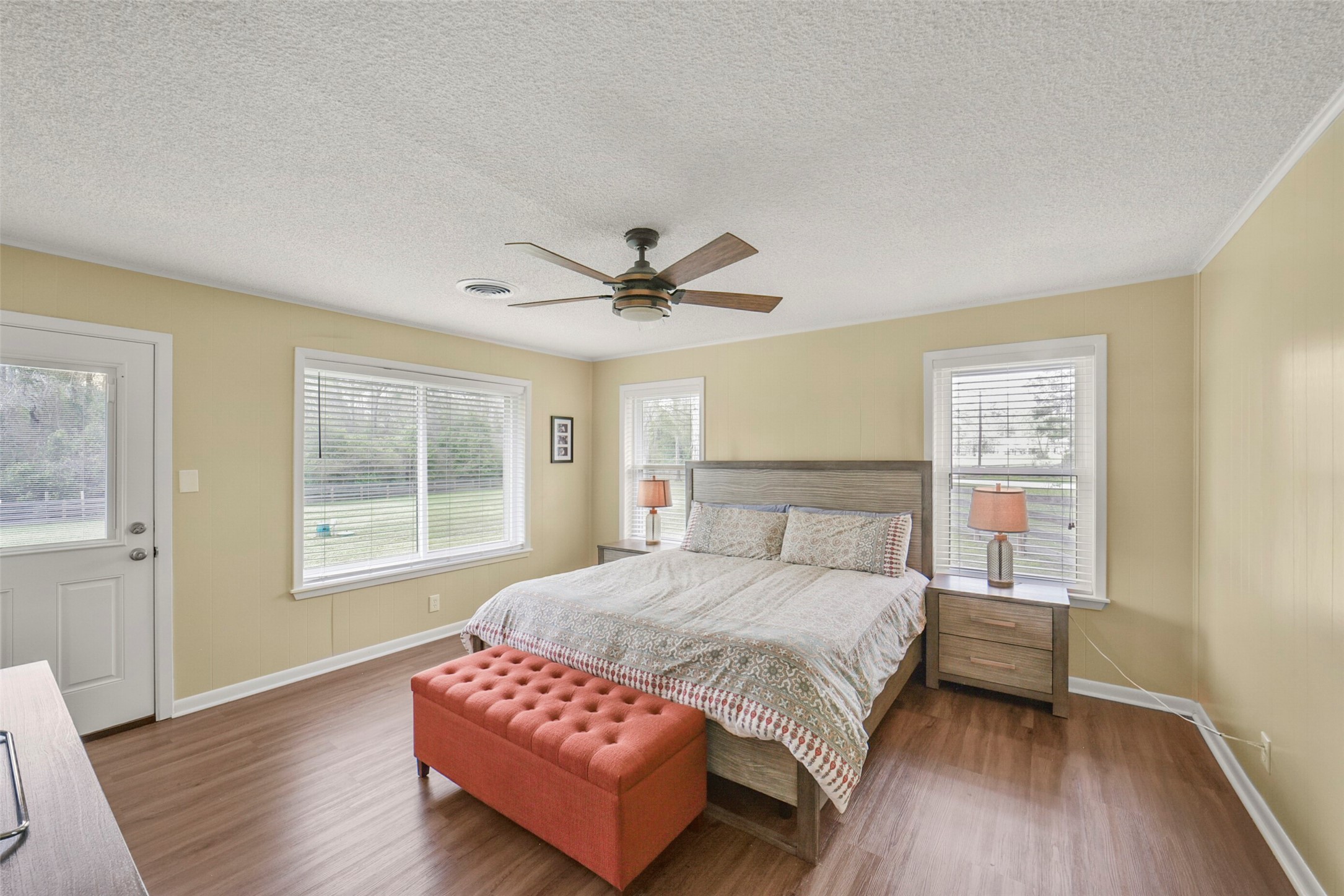 10313 South Williams Road Conroe, TX 77303 - Photo 22 of 48 Primary bedroom with plenty of natural light. Windows updated in 2022.