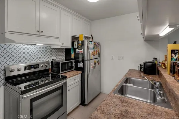 a kitchen with a stove and a sink