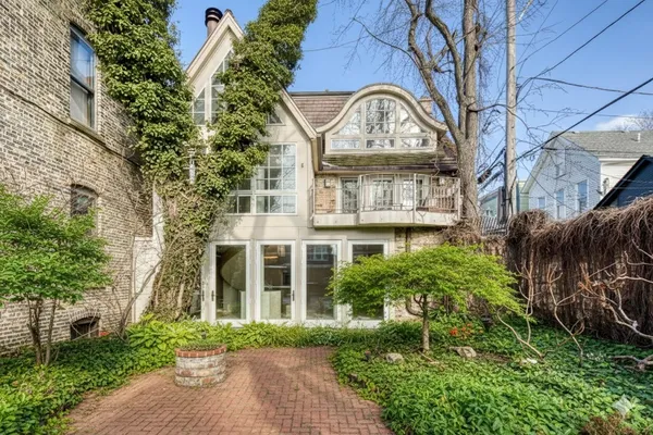 a front view of a residential houses with yard