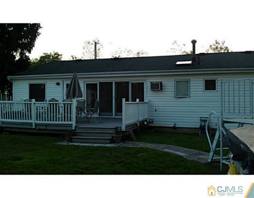 3046 Cheesequake Road Old Bridge, NJ 08859 - Photo 2 of 16 a black and white house with a yard
