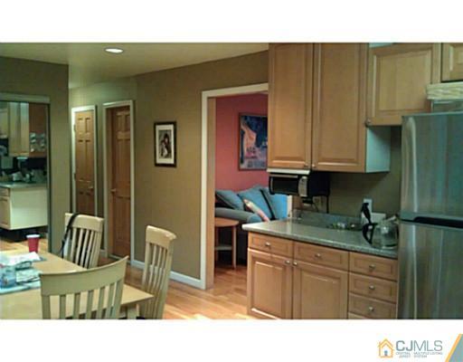 3046 Cheesequake Road Old Bridge, NJ 08859 - Photo 11 of 16 a kitchen with a sink and cabinets