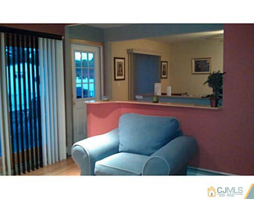 3046 Cheesequake Road Old Bridge, NJ 08859 - Photo 7 of 16 a living room with furniture and a potted plant
