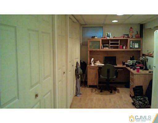 3046 Cheesequake Road Old Bridge, NJ 08859 - Photo 10 of 16 a room filled with furniture and a flat screen tv