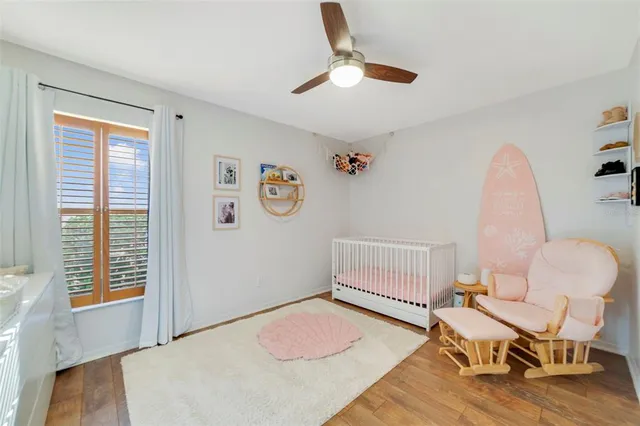 a spacious bedroom with a bed and a window