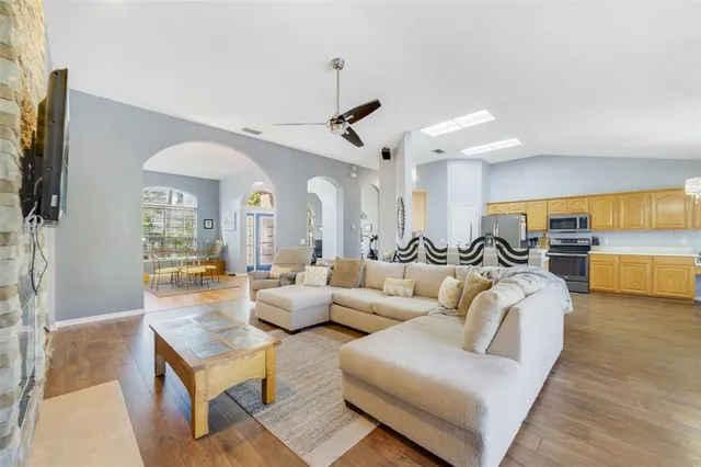 a bedroom with furniture and a flat screen tv