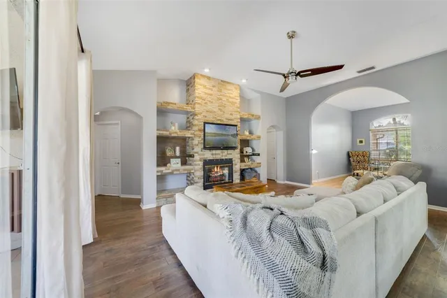 a dining room with furniture and wooden floor