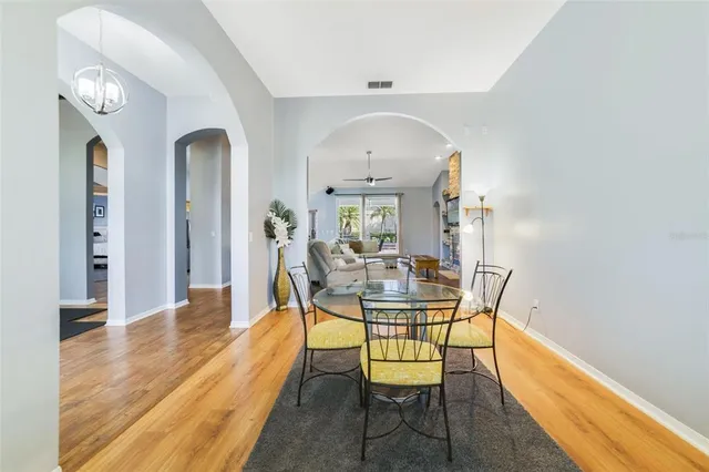 a kitchen with a table and chairs in it