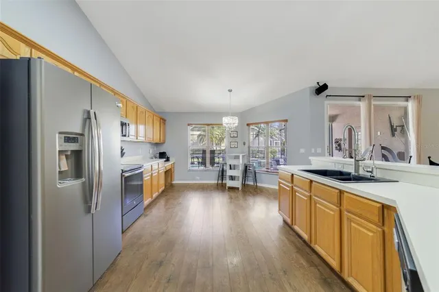a spacious bathroom with a tub a double vanity sink and a large mirror