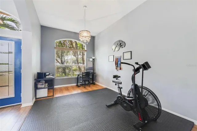 a bedroom with a bed and a chair