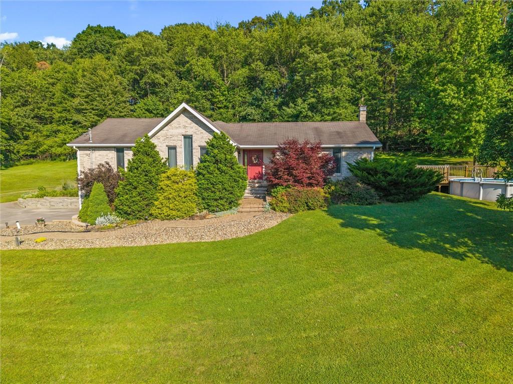 206 Harbison Road Sarver, PA 16055 - Photo 1 of 46 a front view of a house with a yard