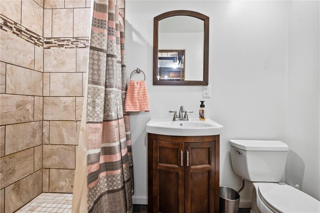 206 Harbison Road Sarver, PA 16055 - Photo 19 of 46 a bathroom with a sink toilet and shower