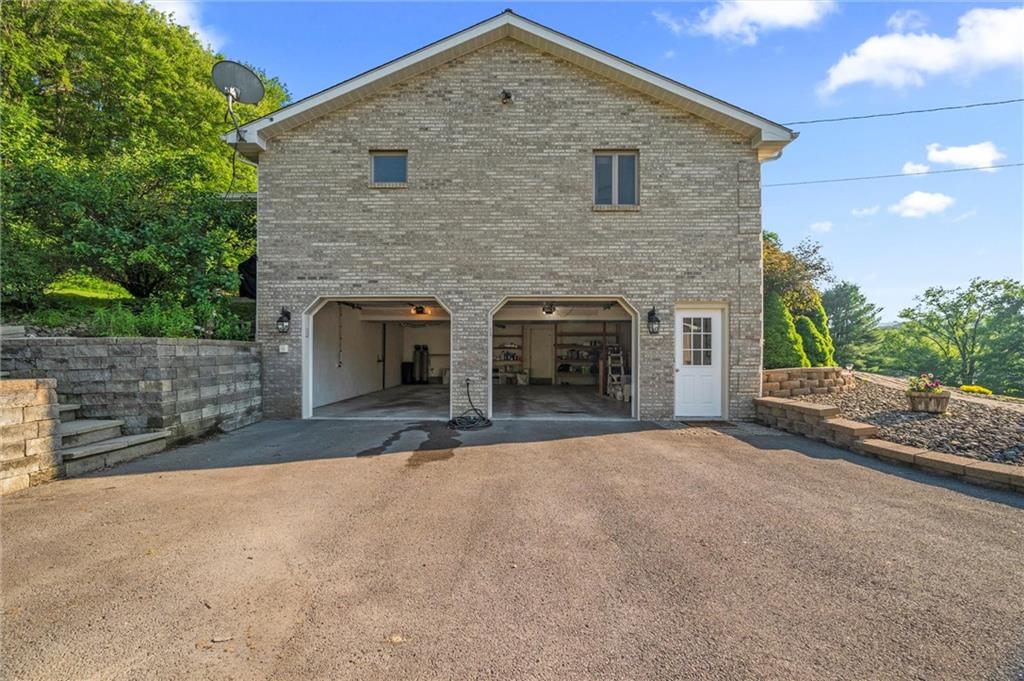 206 Harbison Road Sarver, PA 16055 - Photo 21 of 46 a view of a house with a yard and garage