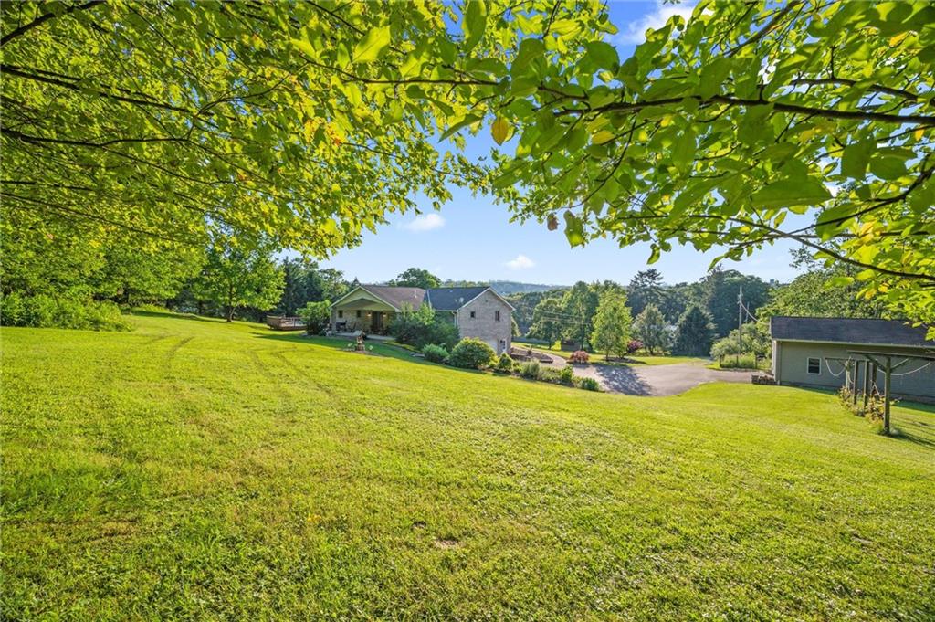 206 Harbison Road Sarver, PA 16055 - Photo 25 of 46 a view of a swimming pool with an outdoor space and seating area