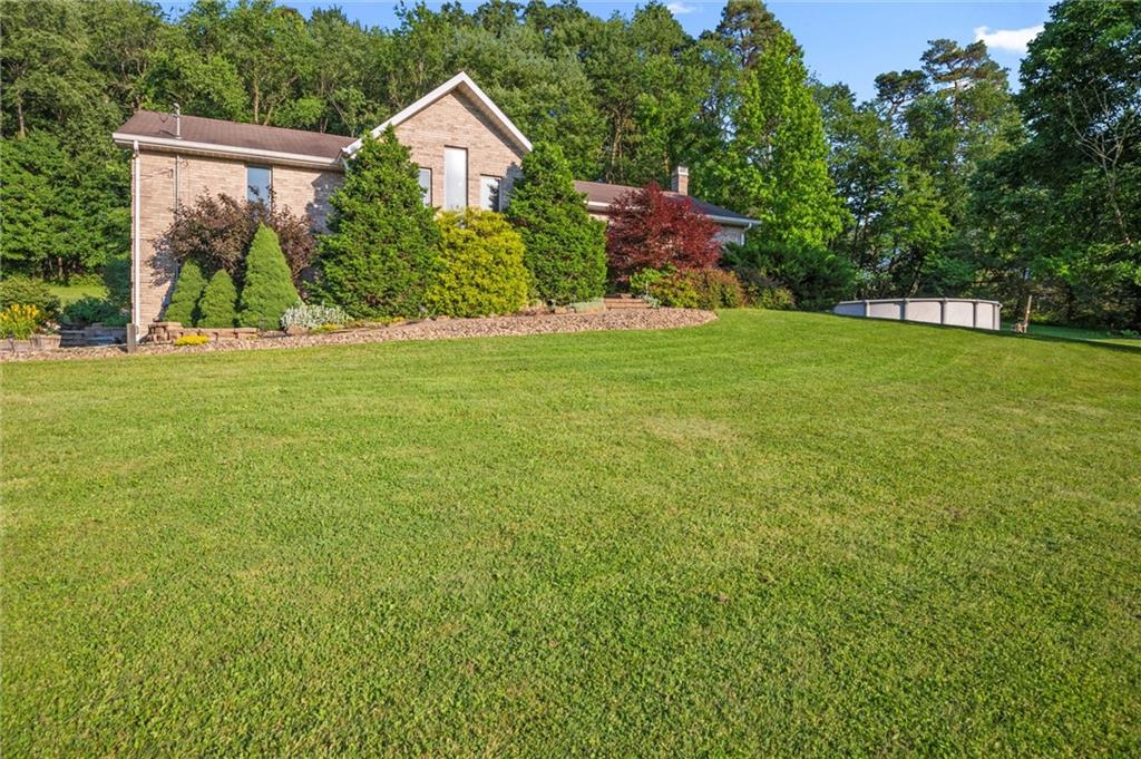 206 Harbison Road Sarver, PA 16055 - Photo 31 of 46 a view of a house with backyard and garden