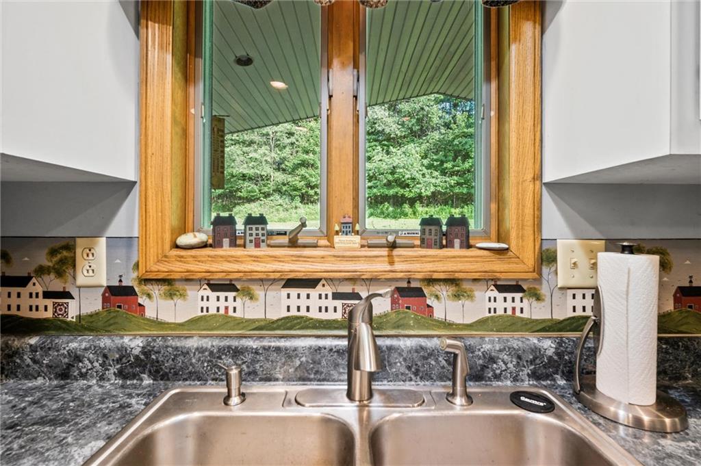206 Harbison Road Sarver, PA 16055 - Photo 10 of 46 a view of a kitchen with a sink and large window