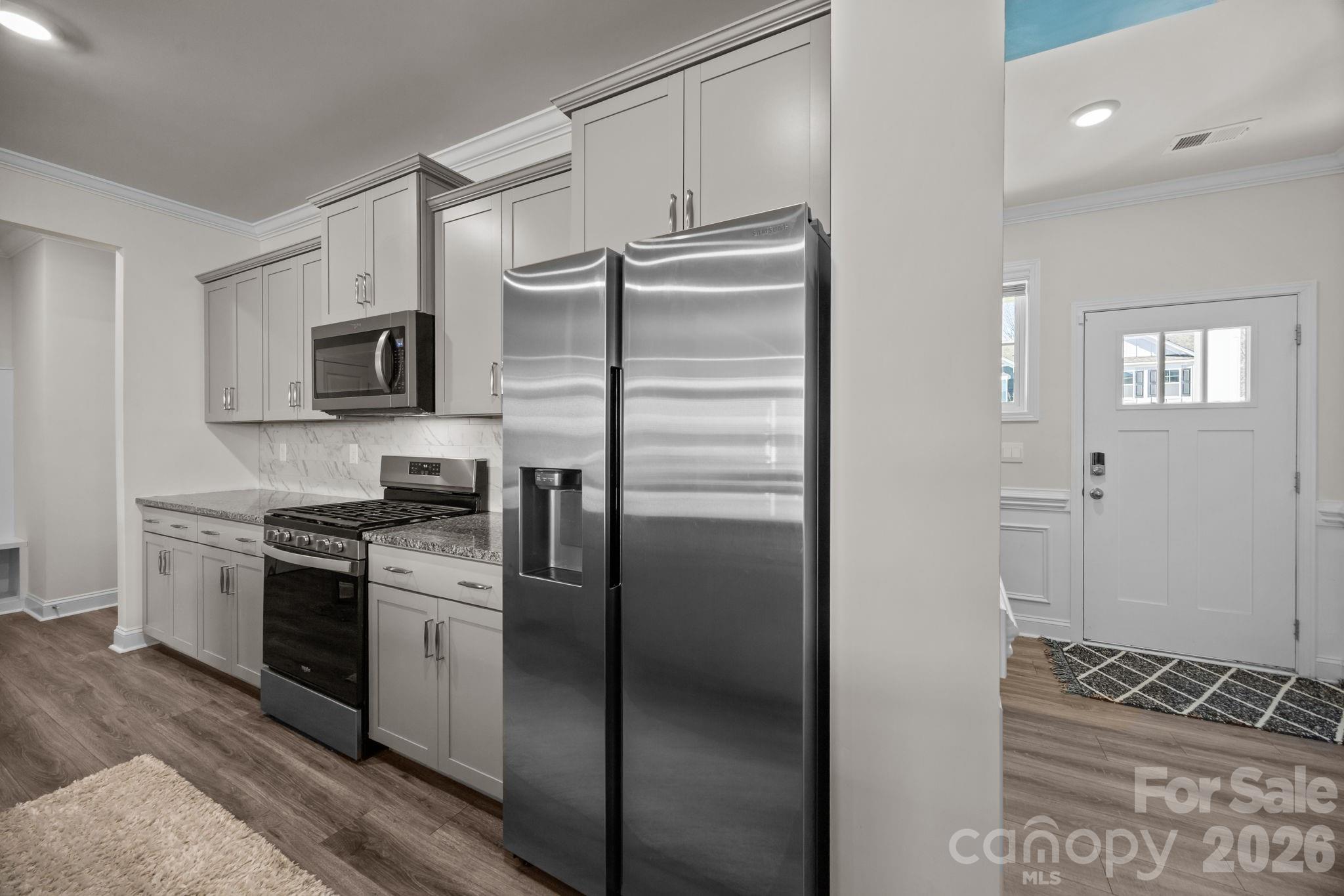 7895 Iron Road Sherrills Ford, NC 28673 - Photo 12 of 38 a kitchen with a refrigerator stove and sink