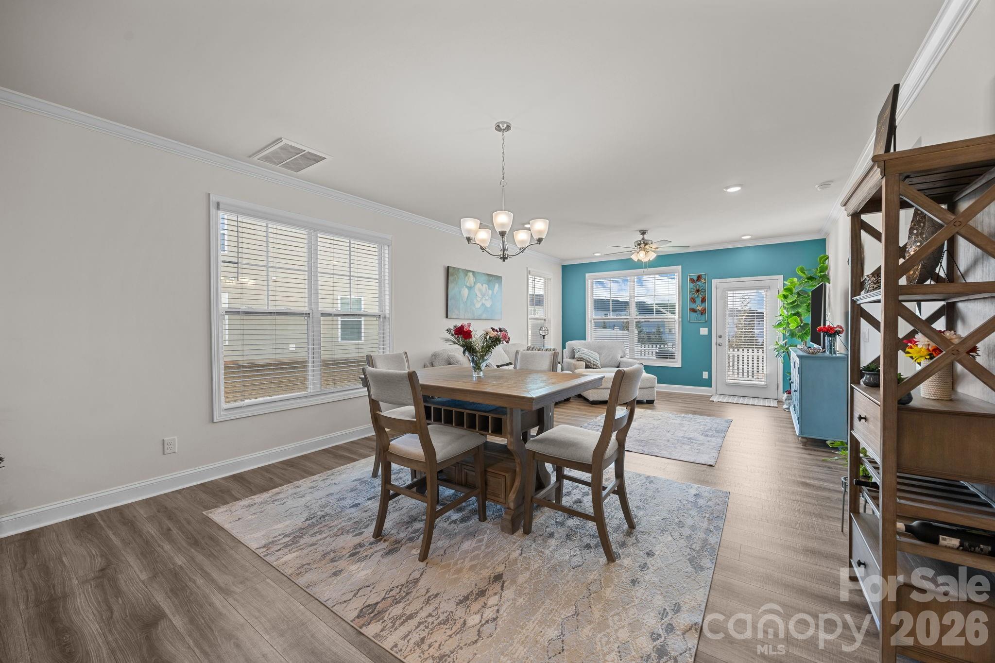 7895 Iron Road Sherrills Ford, NC 28673 - Photo 14 of 38 a view of a dining room with furniture and a chandelier