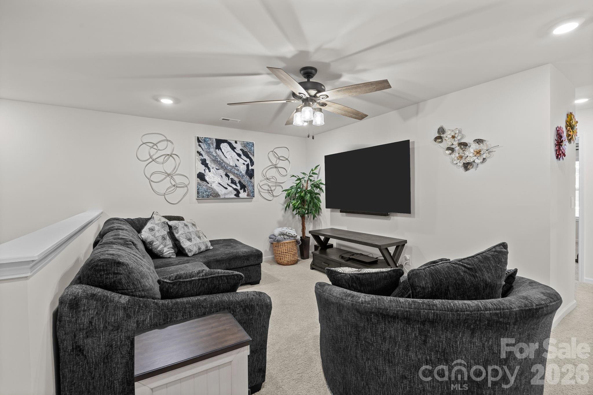 7895 Iron Road Sherrills Ford, NC 28673 - Photo 20 of 38 a living room with furniture and a flat screen tv