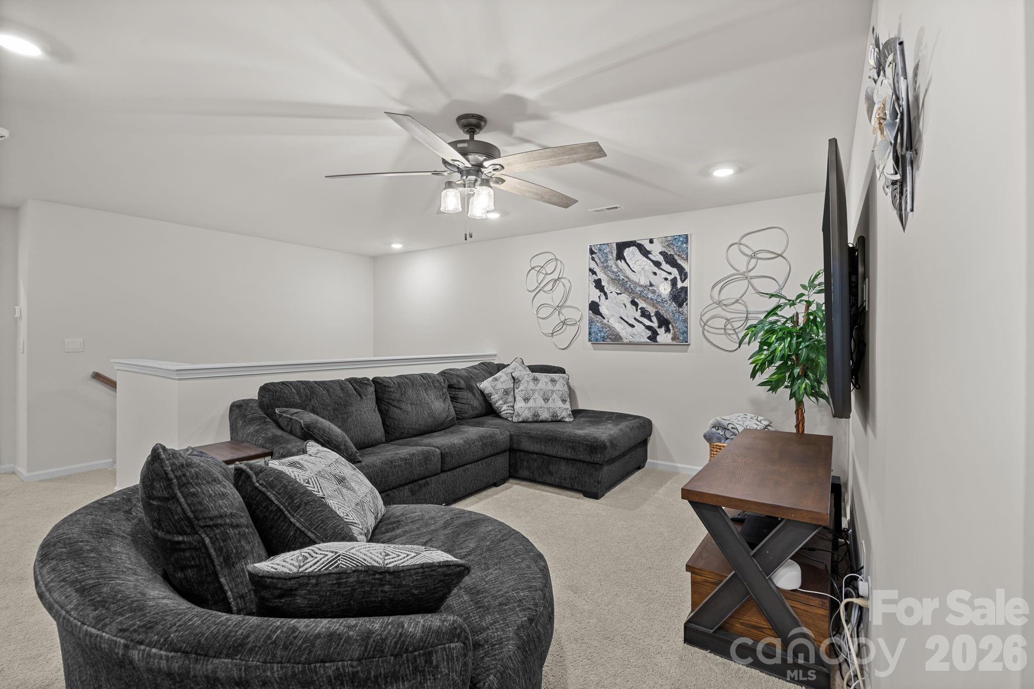 7895 Iron Road Sherrills Ford, NC 28673 - Photo 21 of 38 a living room with furniture and a chandelier