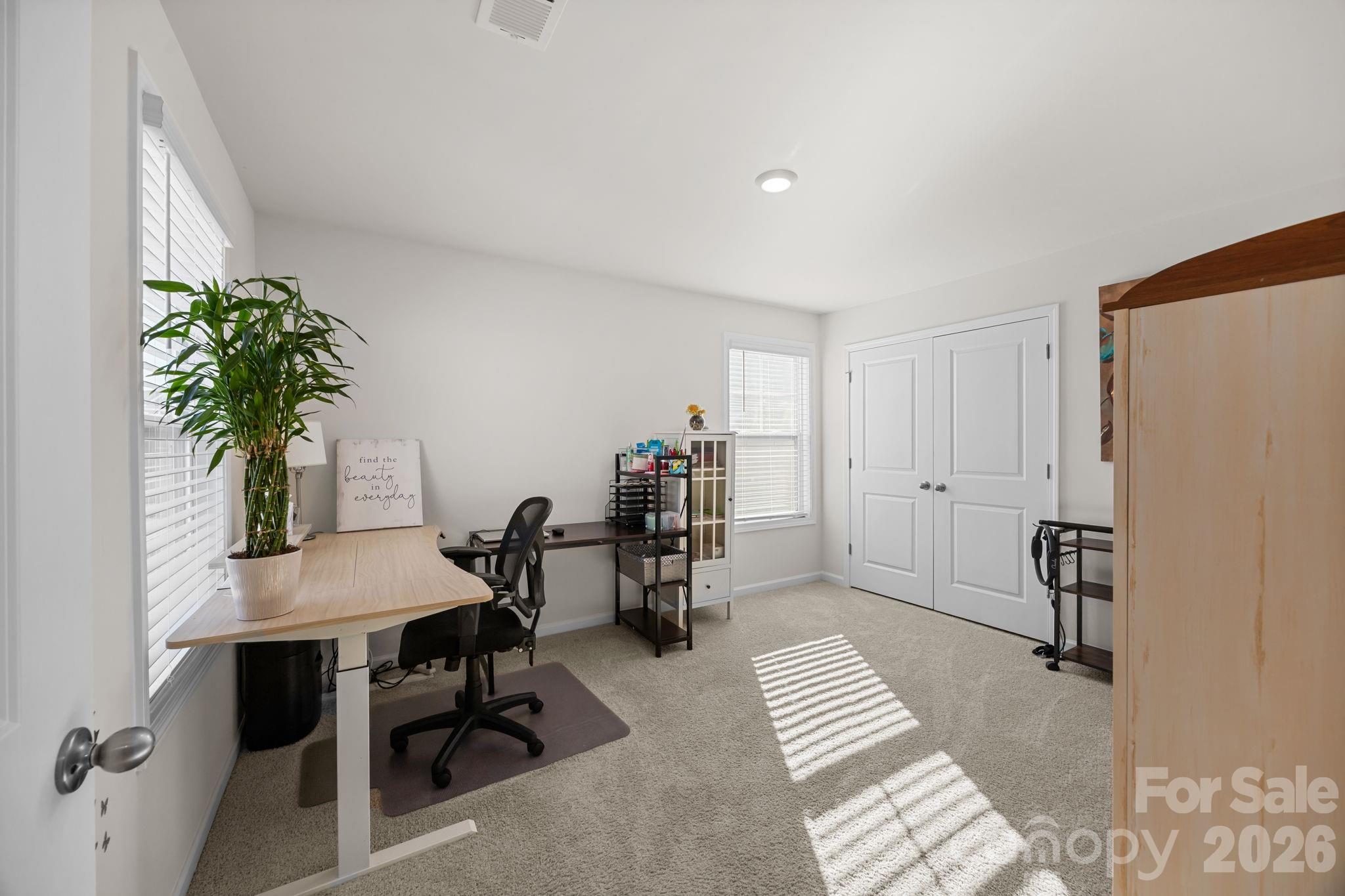 7895 Iron Road Sherrills Ford, NC 28673 - Photo 22 of 38 a view of a workspace with furniture and a potted plant