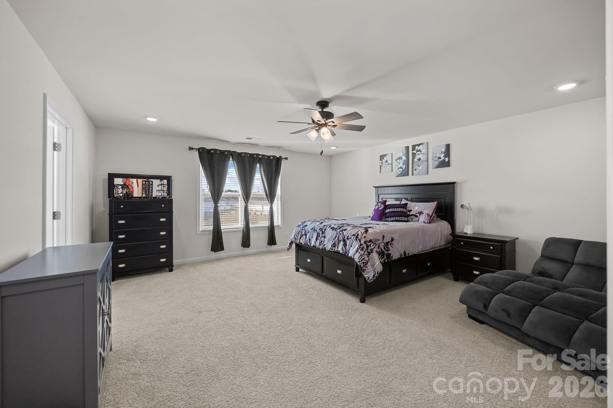 7895 Iron Road Sherrills Ford, NC 28673 - Photo 26 of 38 a bedroom with a bed and furniture