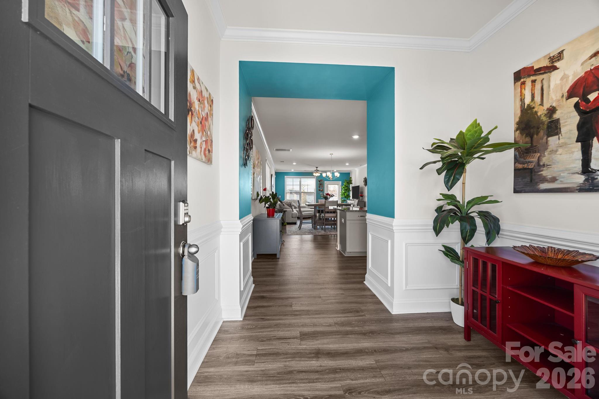 7895 Iron Road Sherrills Ford, NC 28673 - Photo 3 of 38 a view of a hallway view with wooden floor and a potted plant