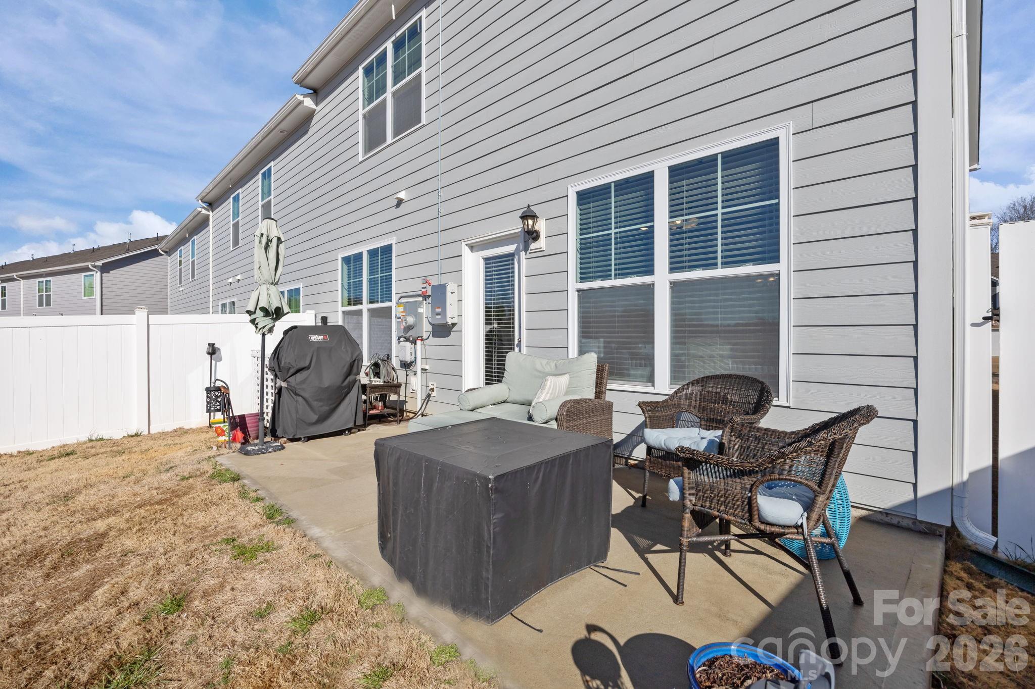 7895 Iron Road Sherrills Ford, NC 28673 - Photo 31 of 38 a view of a backyard with table and chairs and a barbeque