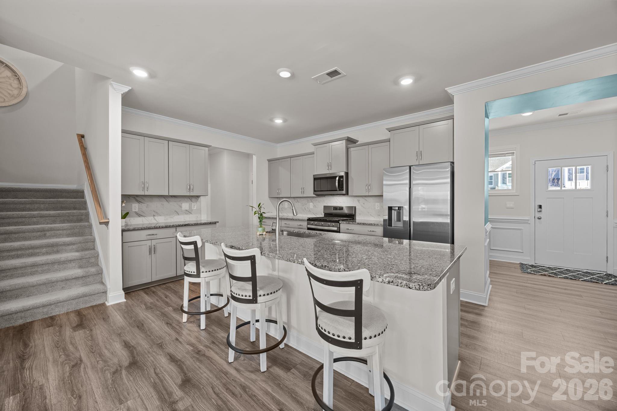 7895 Iron Road Sherrills Ford, NC 28673 - Photo 6 of 38 a kitchen with a sink cabinets and wooden floor