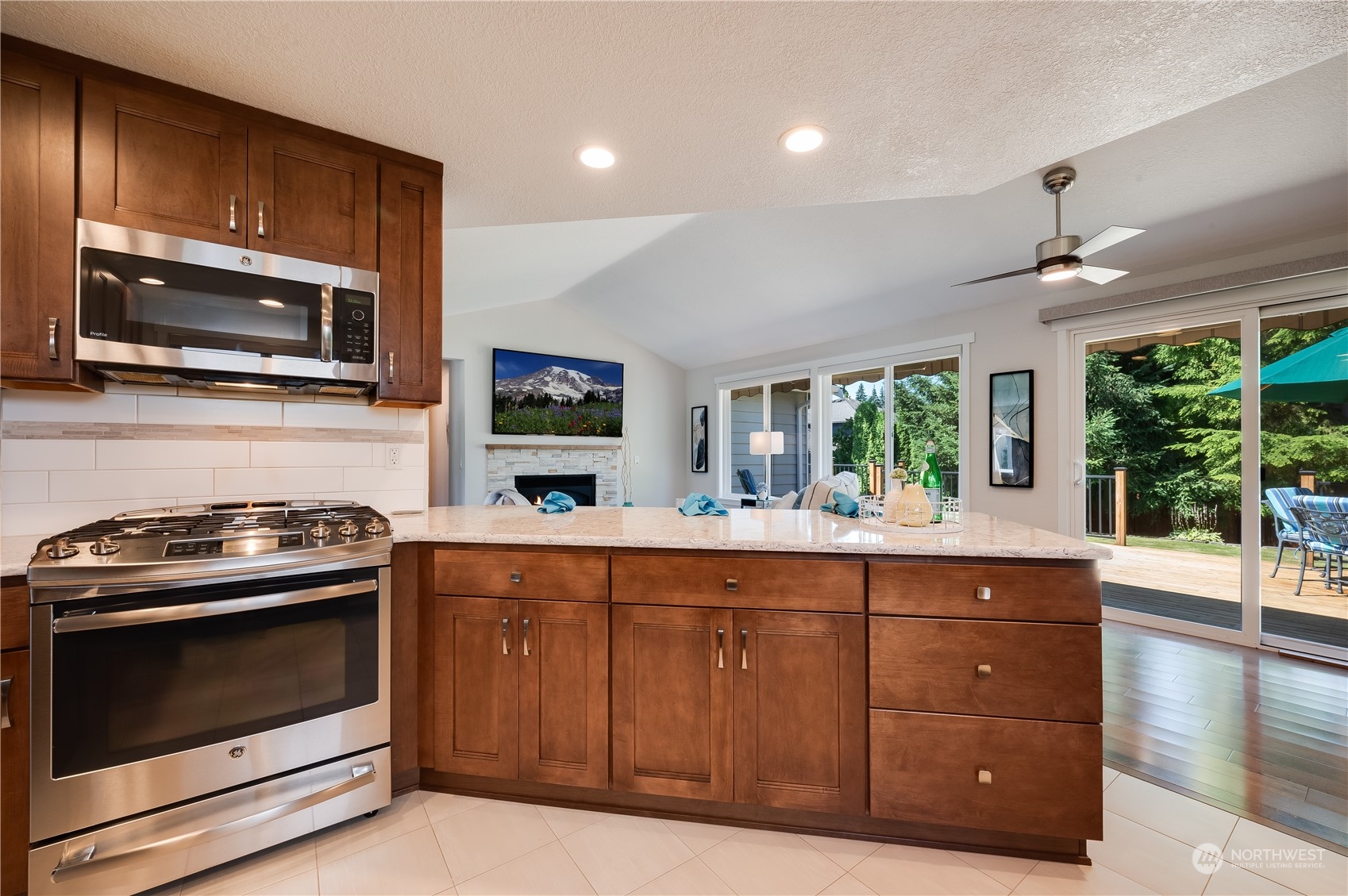 24224 16th Place Southeast Bothell, WA 98021 - Photo 15 of 37 a kitchen with stainless steel appliances granite countertop a stove and a microwave