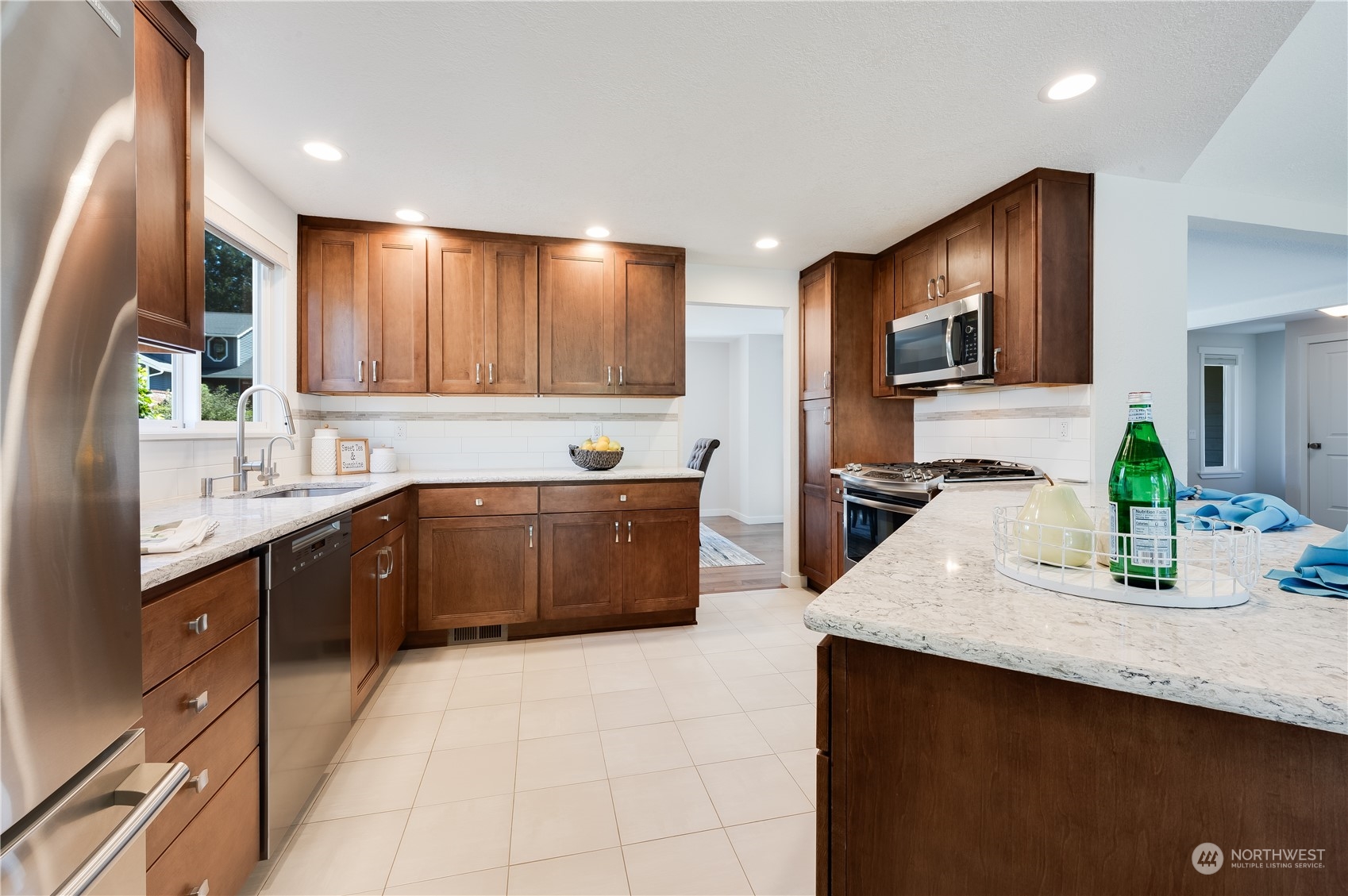 24224 16th Place Southeast Bothell, WA 98021 - Photo 16 of 37 a kitchen with a sink cabinets and wooden floor