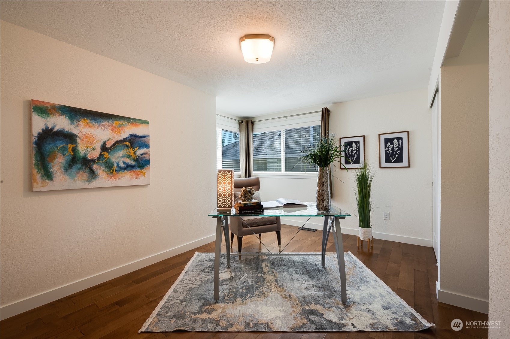 24224 16th Place Southeast Bothell, WA 98021 - Photo 26 of 37 a living room with furniture and a rug