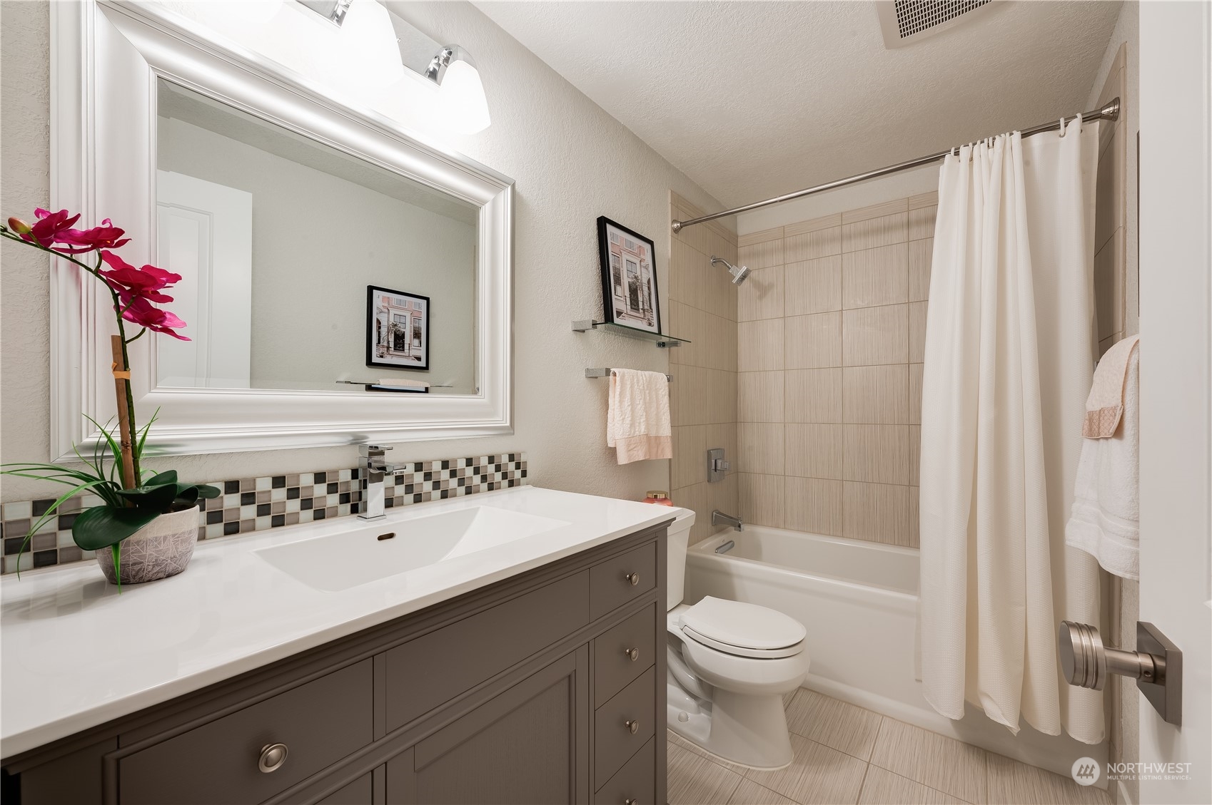 24224 16th Place Southeast Bothell, WA 98021 - Photo 27 of 37 a bathroom with a sink a toilet and shower