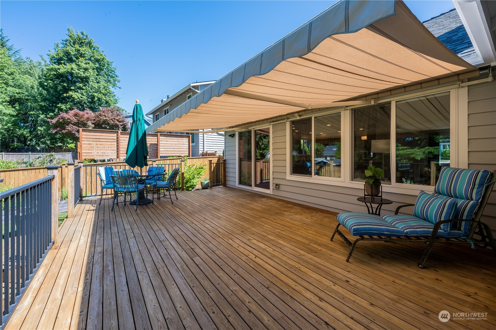 24224 16th Place Southeast Bothell, WA 98021 - Photo 33 of 37 a view of a patio with table and chairs wooden floor and fence